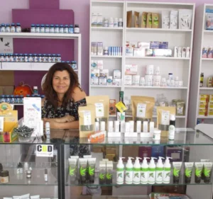 rita in the shop behind the counter selling CBD and HHC products and vapes